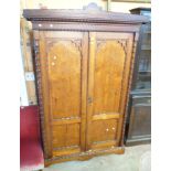 A 4' 11" late Victorian Gothic style pitch pine wardrobe with slide and drawer fitted interior and