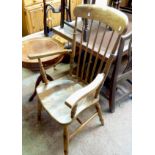 A 20th Century high stick back elbow chair with solid elm seat, set on ring turned supports