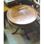 A reproduction drum table, set on turned pillar and reeded tripod base