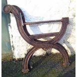 A pair of cast iron bench ends in the curule style