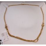A boxed 9ct. gold necklace with double chain lower section