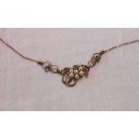 A 9ct. gold pendant necklace, set with cultured pearls and pale blue stones in open scroll settings