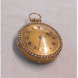 A continental yellow metal lady's fob watch with cobalt blue enamel back, double seed pearl