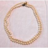 A single string pearl necklace with decorative 14ct. gold clasp - sold with another a/f