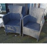 A suite of Jardin Netherlands BV woven plastic patio furniture comprising table and six elbow