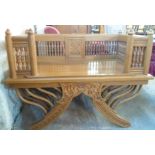 A 3' 5" modern polished wood spindle gallery bench, set on a carved swept base with bentwood