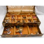 A concertina jewellery box containing a quantity of assorted costume jewellery