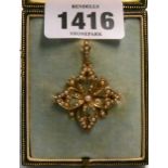 A boxed marked 9ct. yellow metal early 20th Century pendant brooch with seed pearl encrusted