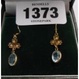 A boxed pair of 9ct. gold aquamarine and seed pearl drop earrings