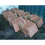 Sixty Victorian terracotta small scallop topped edging tiles