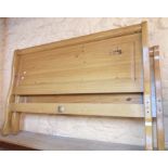 A 4' 6" modern waxed pine bedstead with moulded panel ends and side rails