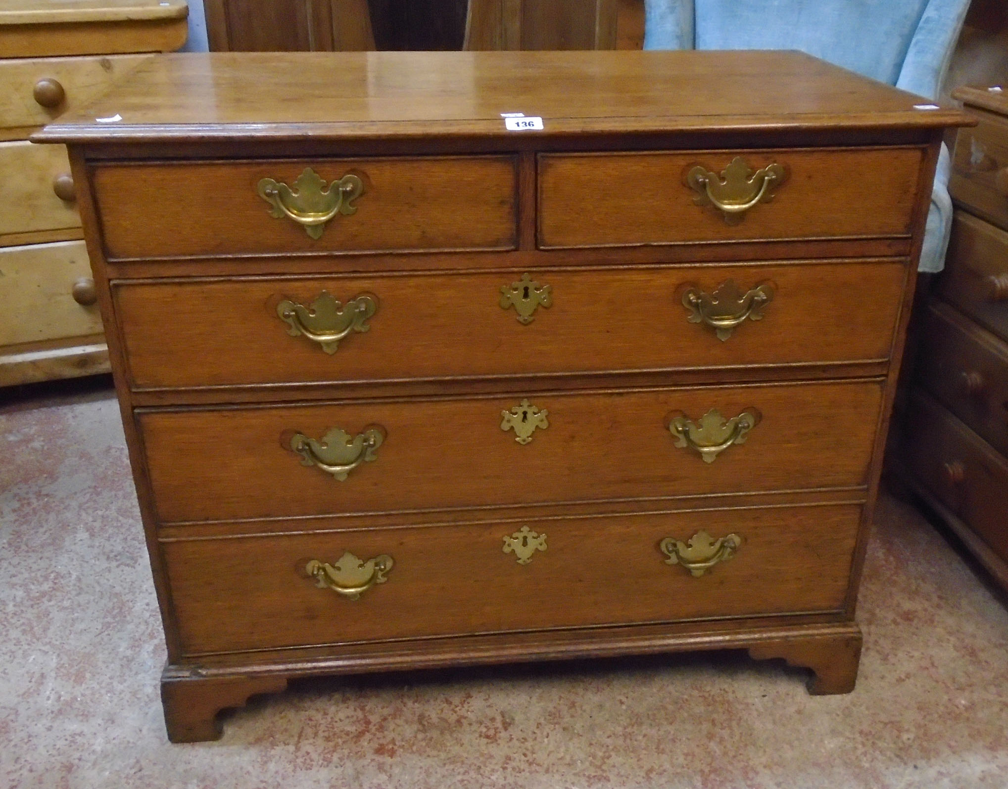 A 3' 3 1/2" late Georgian oak chest of two short and two long graduated drawers, the lower with