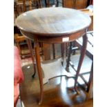 A 20" diameter mahogany two tier occasional table, set on slender cabriole supports