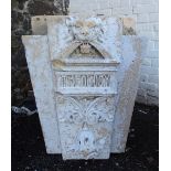 A Victorian carved sandstone key stone with lion mask to top and acanthus scroll bracketed text