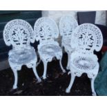 A set of four painted cast aluminium garden chairs in the Victorian style with decorative pierced