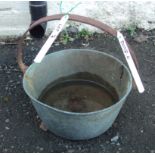 A brass preserve pan with iron handle