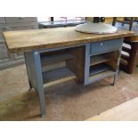 A 4' 11" 20th Century engineer's work table with solid plank top, recess, drawer and cupboard (