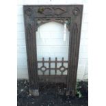 A 20" late Victorian cast iron fire place insert with Gothic style decoration