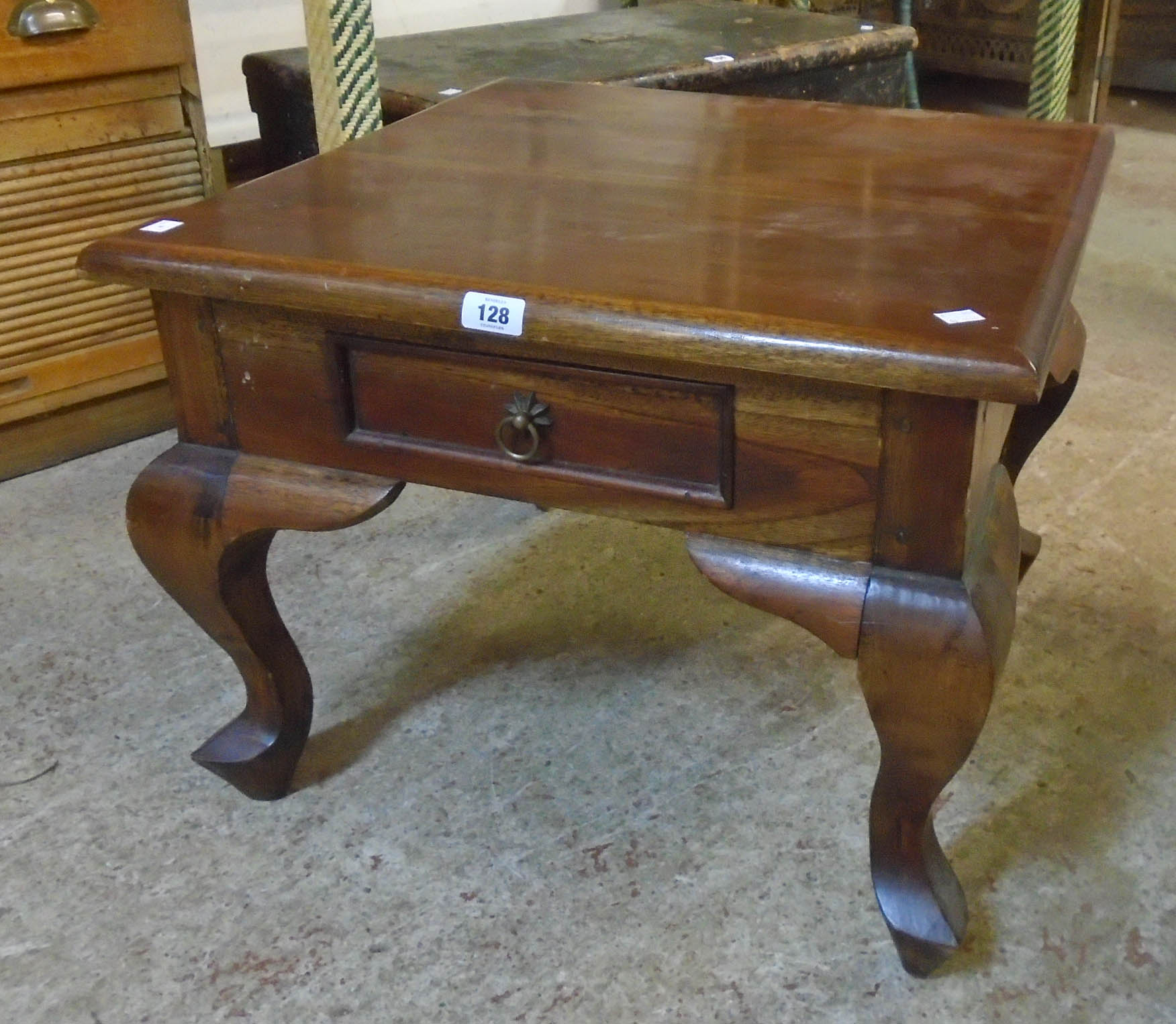 A 24" solid eastern polished hardwood tea table with single frieze drawer, set on heavy cabriole