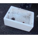 A 24" white porcelain Belfast sink