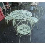 A 28" diameter green painted wrought iron garden table - sold with three chairs to match - some