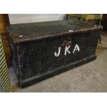 A 35" Victorian stained pine lift-top box with flanking iron carrying handles