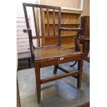 A late Georgian oak framed reeded stick back elbow chair with solid - a/f