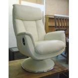 A modern Global Furniture Alliance white leather upholstered reclining armchair, set on a circular