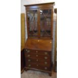 A 31 1/2" 19th Century mahogany and strung bureau bookcase with pair of astragal glazed panel