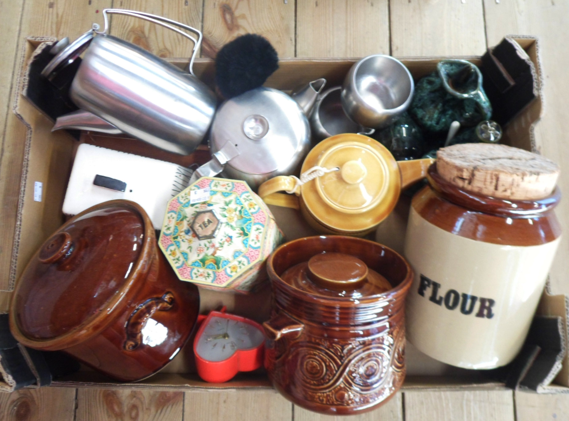 A box containing a quantity of kitchenalia including storage jars, cheese dish, teapot, etc.