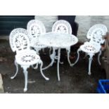 A set of four Victorian style aluminium garden chairs and 27" diameter matching table