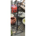A 40 1/2" high three tier wrought iron plant stand