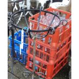 Approximately sixty late 20th Century branded advertising milk bottles in crates including various