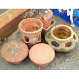 Various terracotta items including two chimney cowls, two strawberry pots, plant pots and a clog