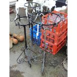 Three painted wrought iron plant pot stands