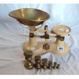 A set of balance scales and part set of six brass bell weights