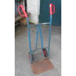 A metal framed two wheeled sack truck with rubber tyres