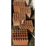 Thirty scalloped shaped terracotta edging tiles