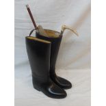 A pair of French rubber riding boots - size 40 - sold with two riding crops