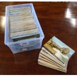 A box containing a collection of mainly mid 20th Century postcards