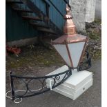 A Sugg portico light in the Victorian style with faceted coppered frame and white glass panels,