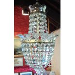 A pendant basket pattern light fitting with glass collars and faceted lustre drops