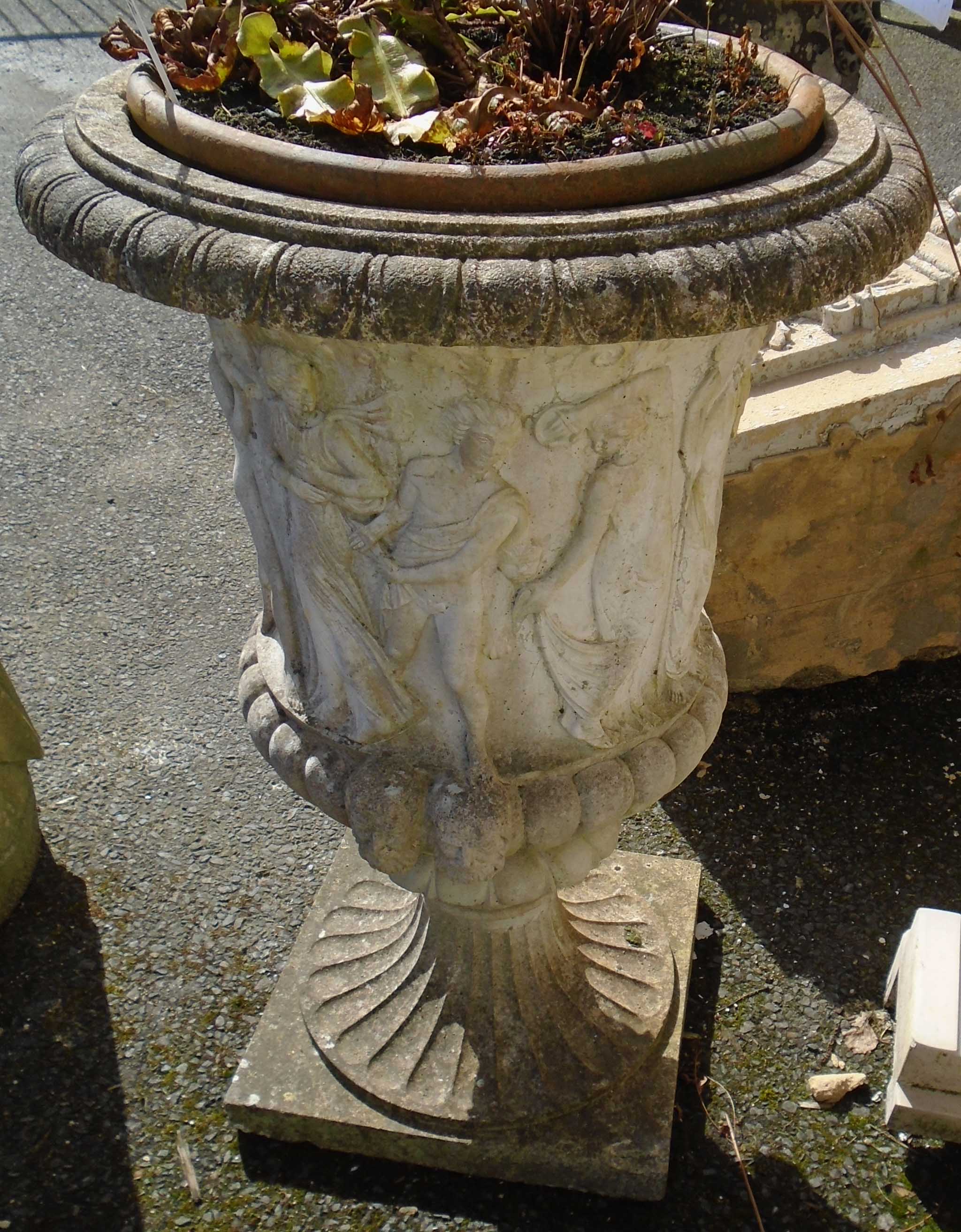 A 3' 1" pre-cast garden planter in the form of a Classical urn with figural decoration