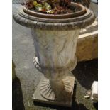 A 3' 1" pre-cast garden planter in the form of a Classical urn with figural decoration