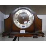 A mid 20th Century stained oak cased mantel clock with eight day Westminster chiming movement