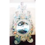 A modern continental porcelain dressing table mirror with applied cherub decoration