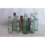 Various glass bottles including ginger beer, lemonade cod bottles and a stoneware ink bottle -