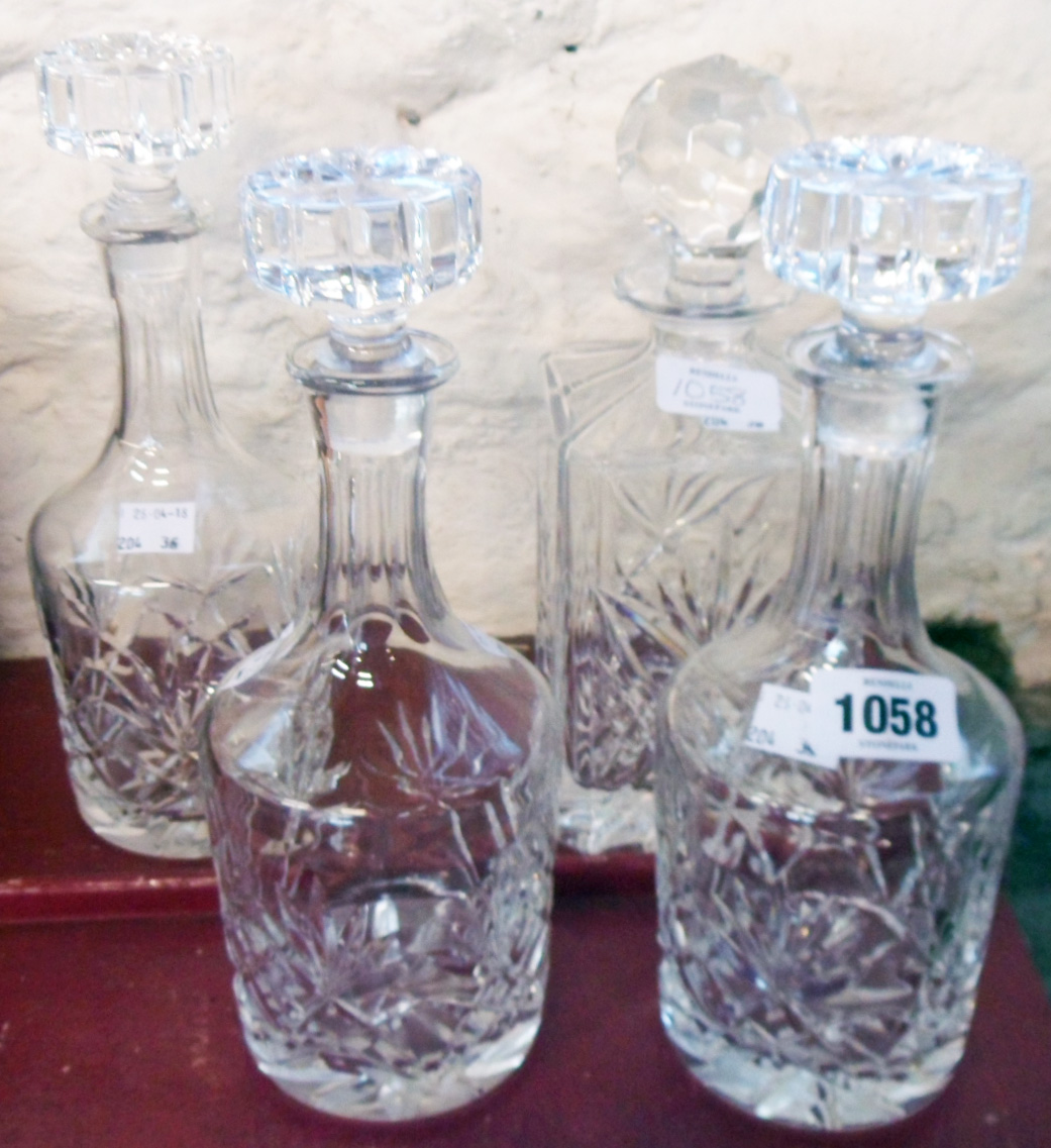 Three matching cut glass Sherry decanters - sold with a cut glass spirit decanter