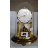 A vintage Prescott anniversary clock under perspex dome