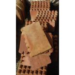 Thirty five scalloped shaped terracotta edging tiles